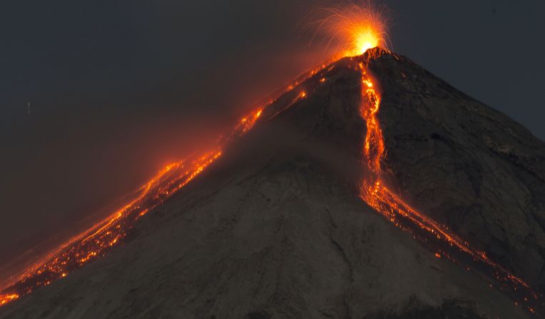 Taken with a long exposure, the image shows Volcan de Fuego -- or Volcano of Fire -- spewing hot molten lava from its crater on early Wednesday. A government spokesperson said the volcano was billowing "fiery clouds" throughout the day.