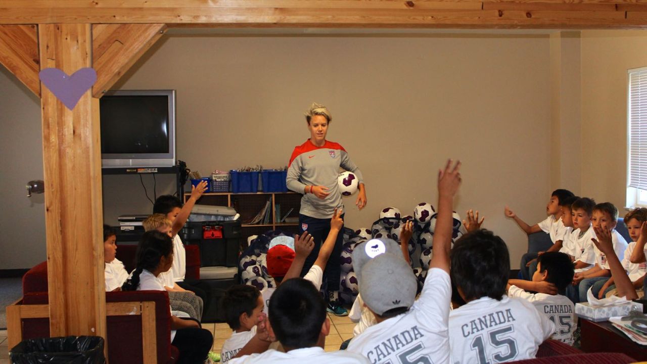Lori Lindsey, former U.S. national footballer, speaks to young players at Chief Jimmy Bruneau Regional High School in Behchoko, Northwest Territories.