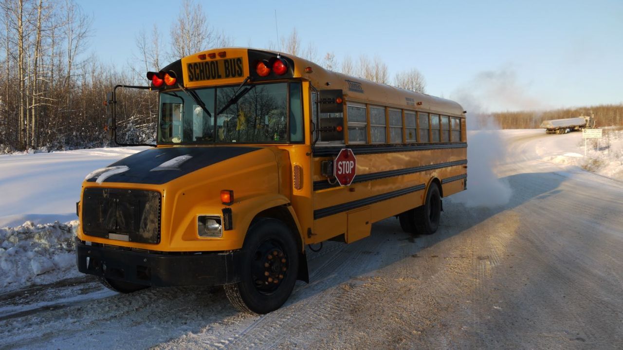 Twenty students from the Northwest Territories hamlet of Fort Liard sat in this school bus for almost 1,000 miles, in temperatures below -30C, to reach a tournament in Edmonton.