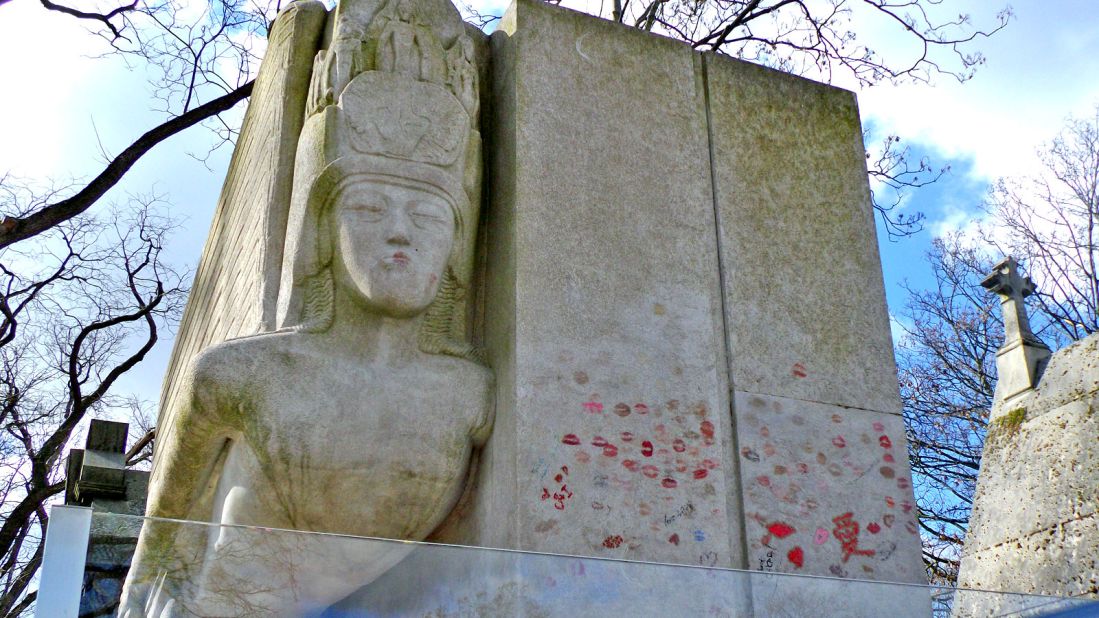 The pouting lips of the Art Deco man-in-flight adorning Wilde's tomb seem to be asking for a kiss.