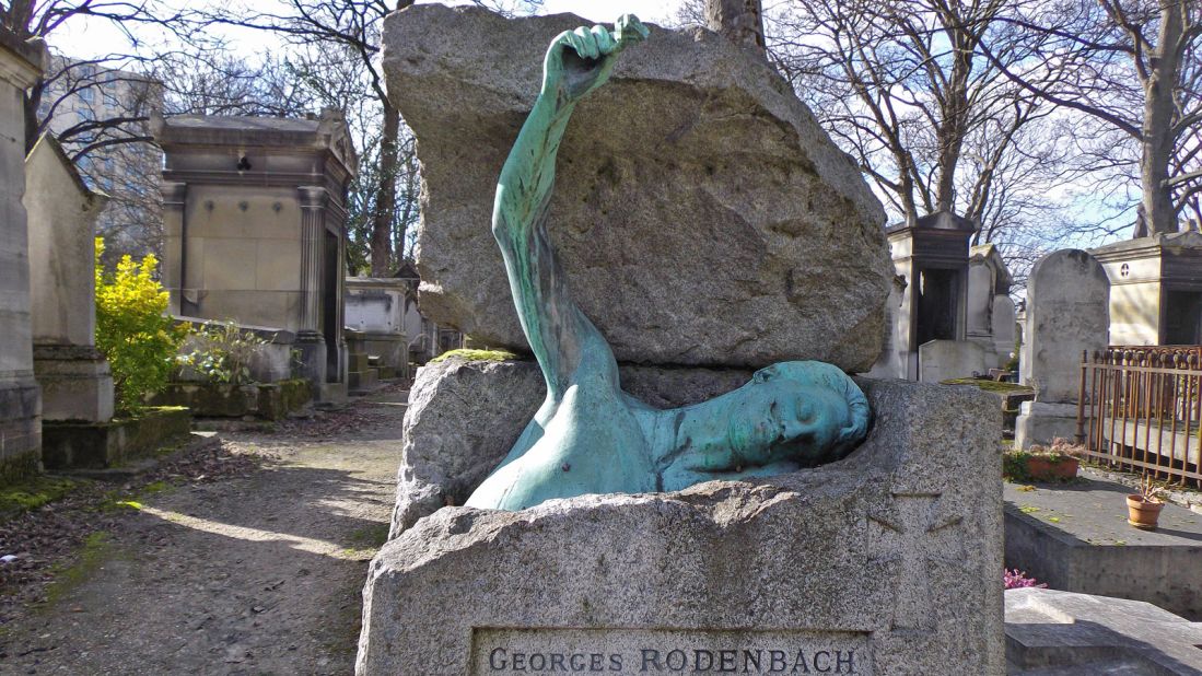 Belgian writer Georges Rodenbach's grave features a bronze of him trying to break out of his tomb. Somewhat disturbing but artistically pleasing.