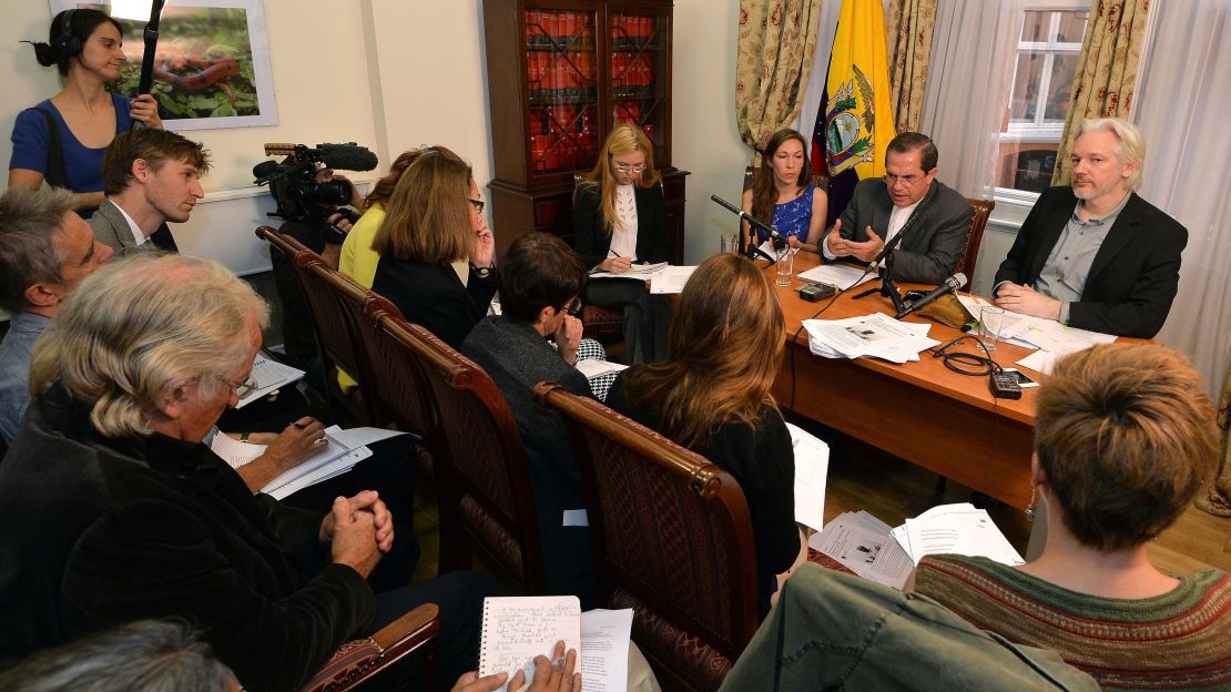 WikiLeaks founder Julian Assange, far right, and Ecuador's Foreign Minister Ricardo Patino sitting next to him, attend a press conference inside the Ecuadorian Embassy in London, England on August 18, 2014.