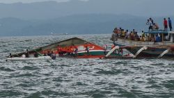 Rescuers help passengers from a capsized ferry boat in Ormoc city on Leyte Island, Philippines, on July 2, 2015.