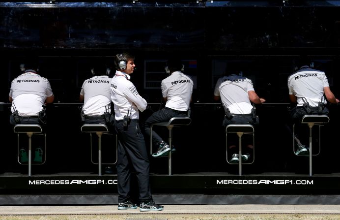Her husband is Mercedes GP Executive Director Toto Wolff, who is pictured looking on from the pit wall.
