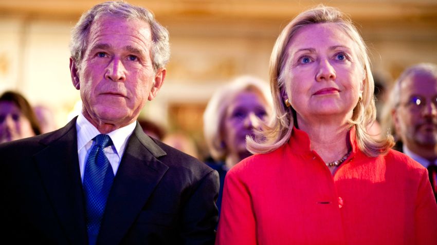 Former President George W. Bush (L) and Secretary of State Hillary Clinton watch a video at the Summit to Save Lives on September 13, 2011 in Washington, DC.