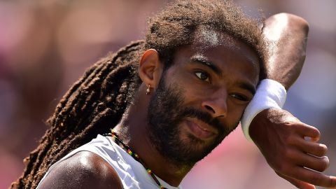 Feeling the heat: Germany's Dustin Brown on his way to a third round defeat to Viktor Troicki of Serbia at Wimbledon.