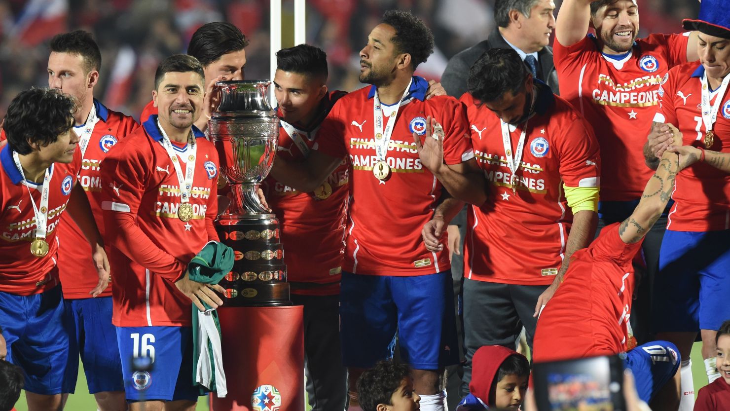 Chile's players celebrate with the Copa America trophy after being Argentina on penalties in the final in Santiago.