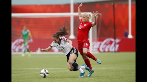 England's Katie Chapman knocks down Germany's Sara Dabritz during the second half of the Women's World Cup soccer third-place match on Saturday.