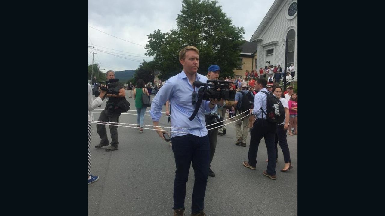 Hillary Clinton's campaign used a rope to keep journalists away from the candidate on Saturday while she walked in the Gorham, New Hampshire, July Fourth parade.