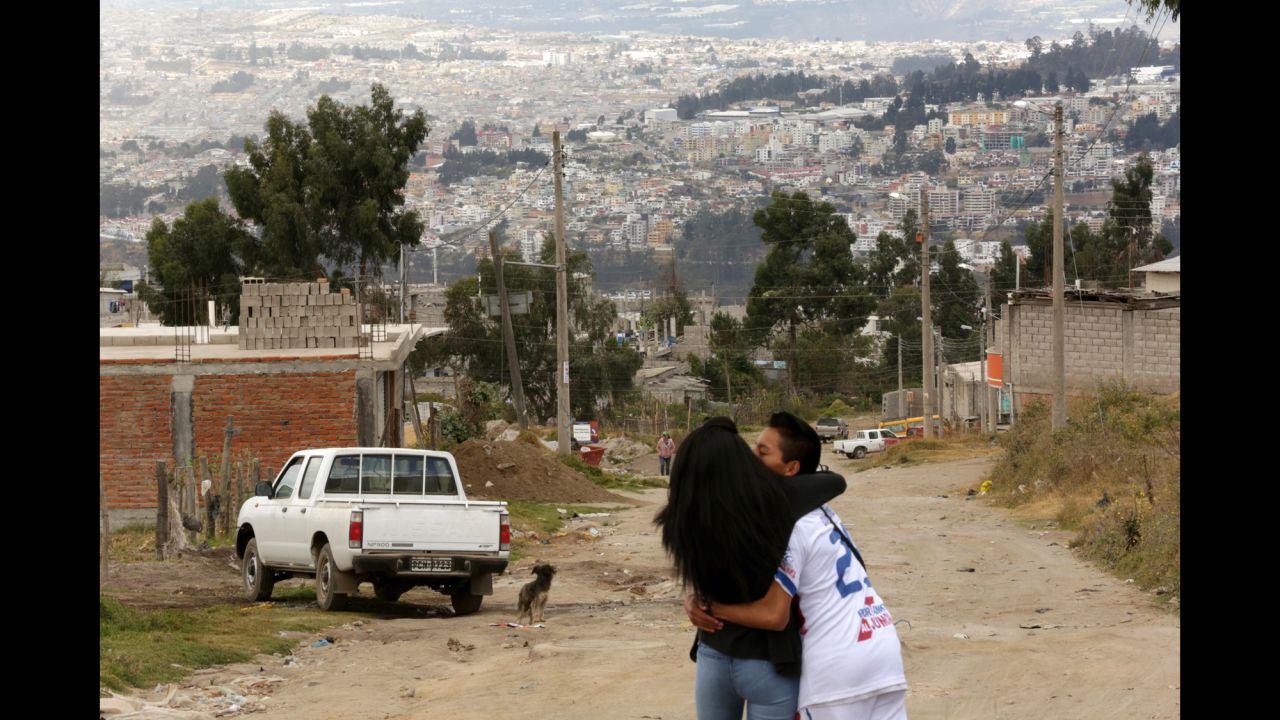 A couple embrace on the foothills of Pisuli, a neighborhood in North Quito, where Pope Francis will visit this week as part of his South American trip. 