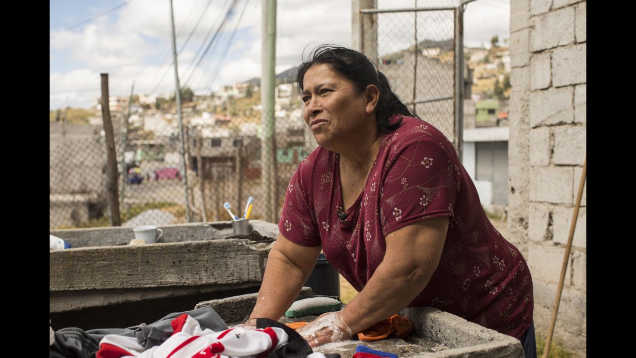 Mary Torres, 58, washes laundry for her five children on Saturday, July 4. She is hoping the Pope's visit will help bring attention to the poor in Quito.
