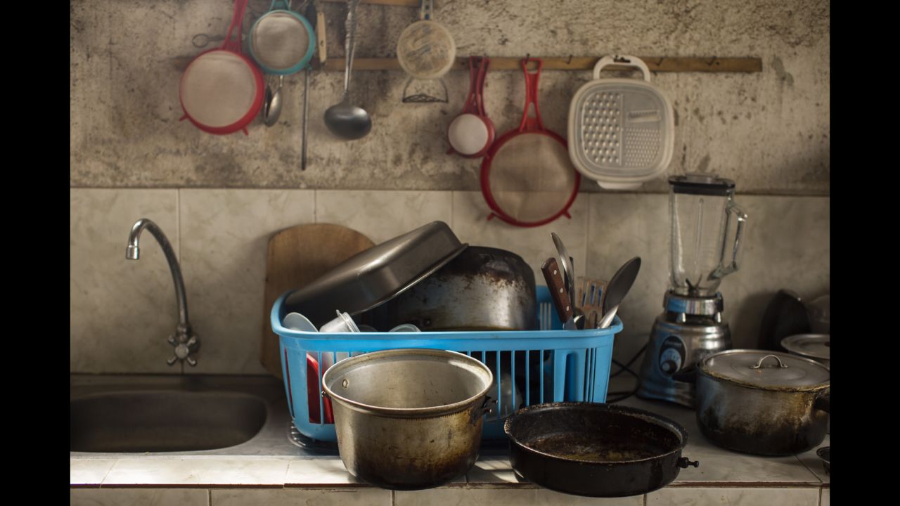 Pots and pans sit beside the sink in Mary Torres' kitchen. 