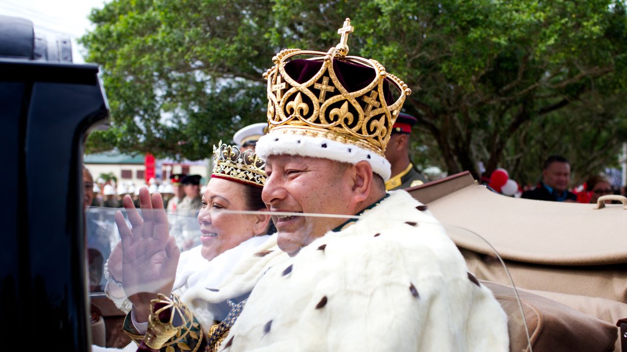 Newly crowned King Tupou VI and his wife, Queen Nanasipau'u, of Tonga proceed through the streets to the Royal Palace as part of the official coronation ceremony on July 4.