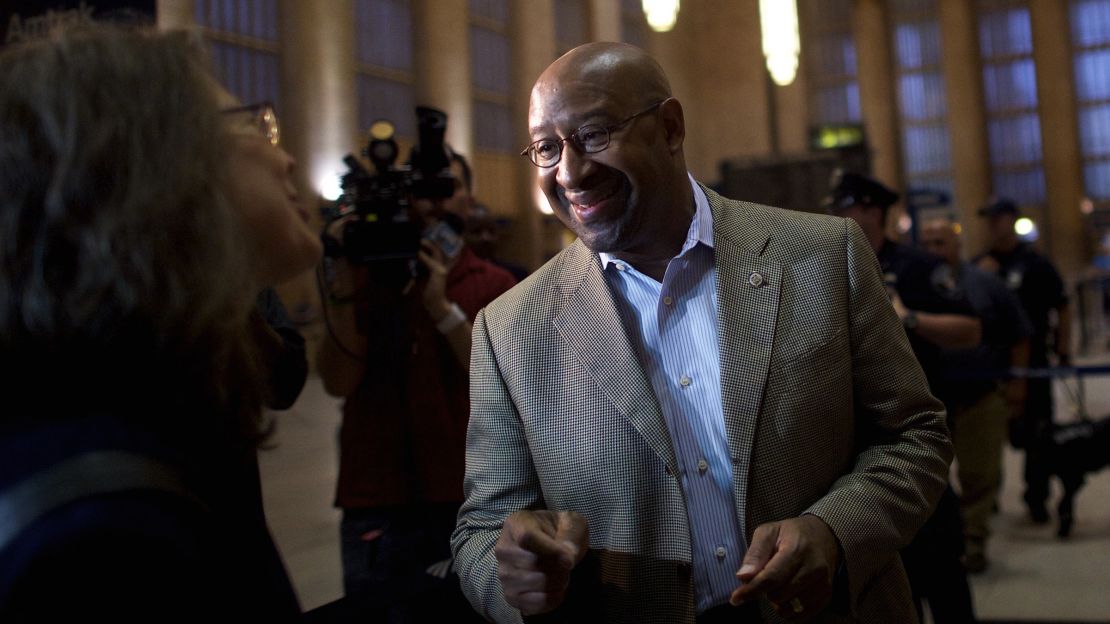Mayor of Philadelphia Michael Nutter greets a line of travelers for the first Amtrak northbound service from 30th Street Station with a 5:53am departing train, after last week's derailment, on May 15, 2015 in Philadelphia, Pennsylvania.