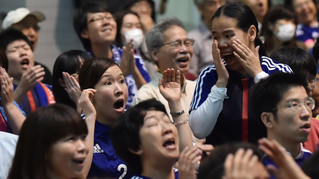 Japanese football fans react to a U.S. goal at a public screening of the game in Tokyo.