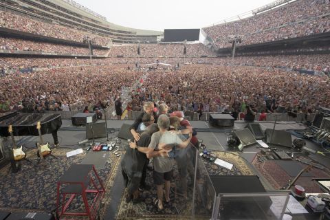 Members and guests of the Grateful Dead embrace during the band's final show on Sunday, July 5, in Chicago.