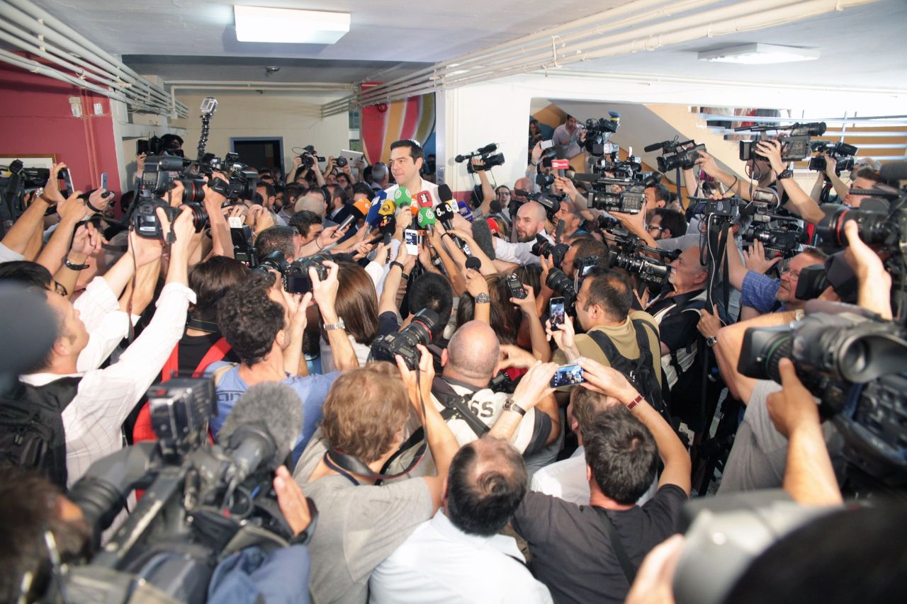 Greece's Prime Minister Alexis Tsipras speaks to the media after voting at a polling station on Sunday, July 5.