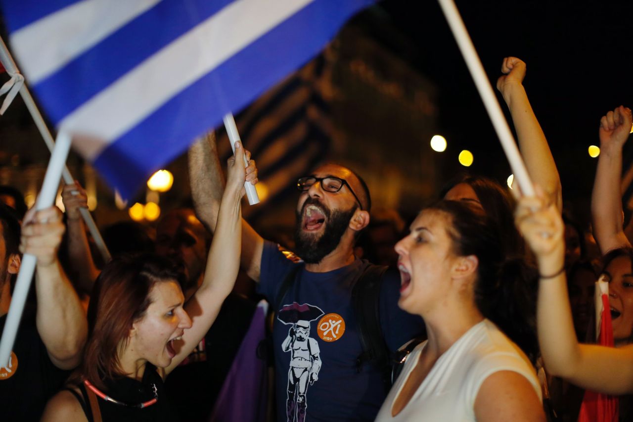 Supporters of the No vote celebrate after the results of the referendum in Athens on Sunday, July 5, 2015. Voters in Greece resoundingly rejected creditors' demands for more austerity in return for rescue loans, backing Prime Minister Alexis Tsipras, who insisted the vote would give him a stronger hand to reach a better deal.