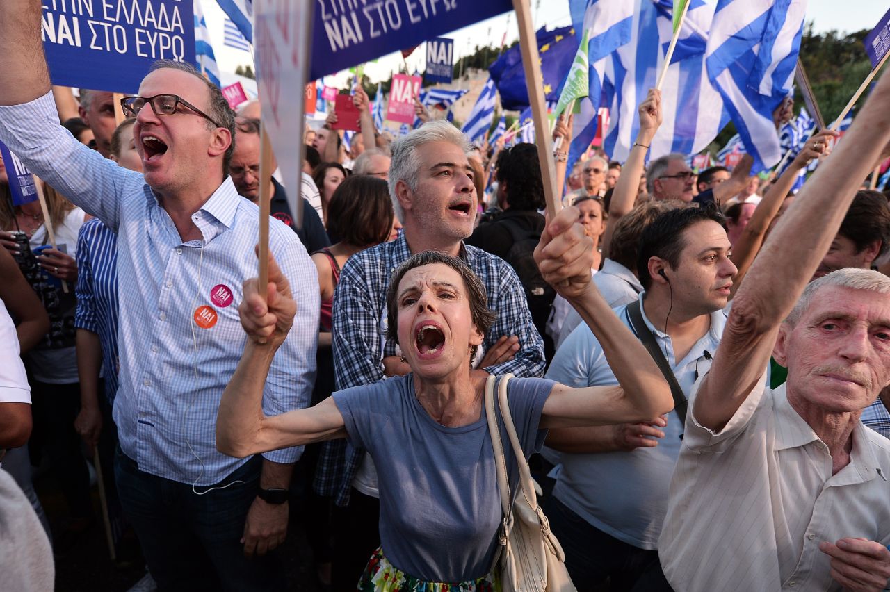 Pro-Europe protesters attend a 'Yes' rally in central Athens. Competing rallies occurred in central Athens late Friday evening as Greek Prime Minister Alexis Tsipras urged thousands of supporters to vote 'No' in the Sunday referendum so as to 'live with dignity in Europe.' 