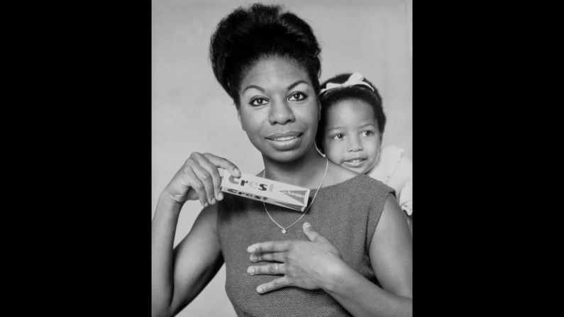 Simone poses for a Crest toothpaste advertisement with her daughter, Lisa Celeste Stroud, circa 1964.