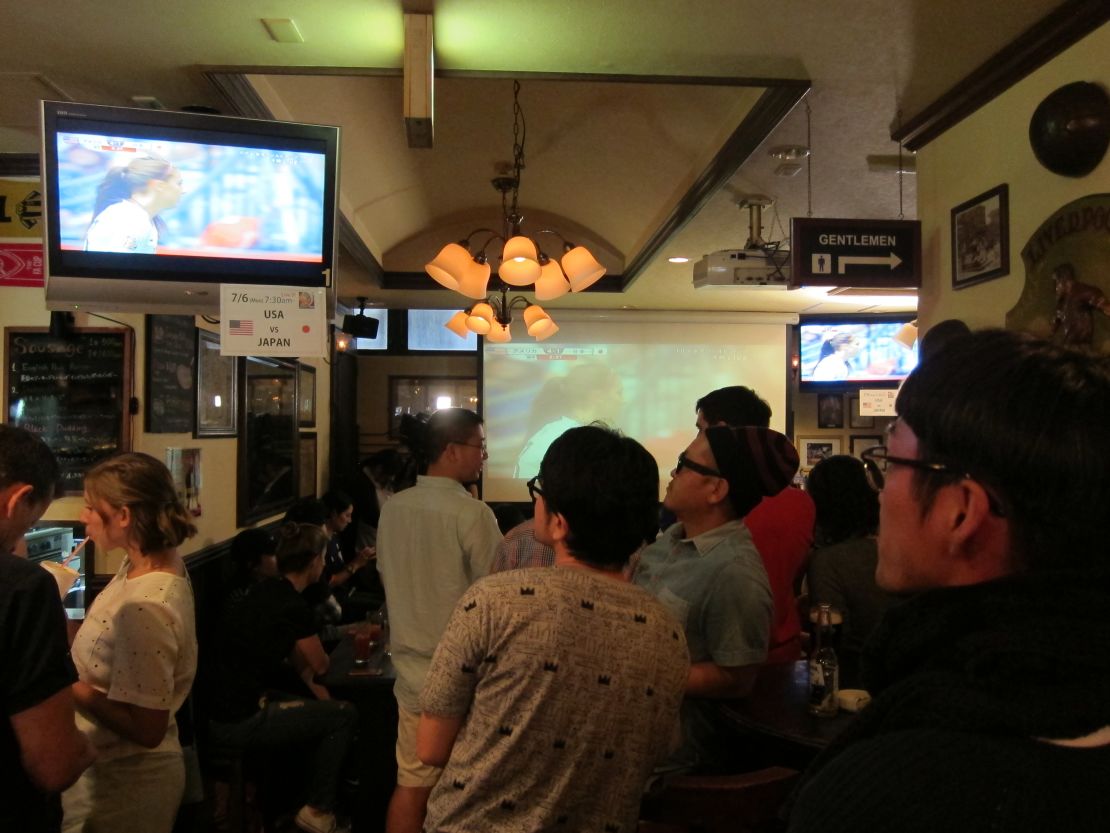 Japanese fans watch the match in a Tokyo bar