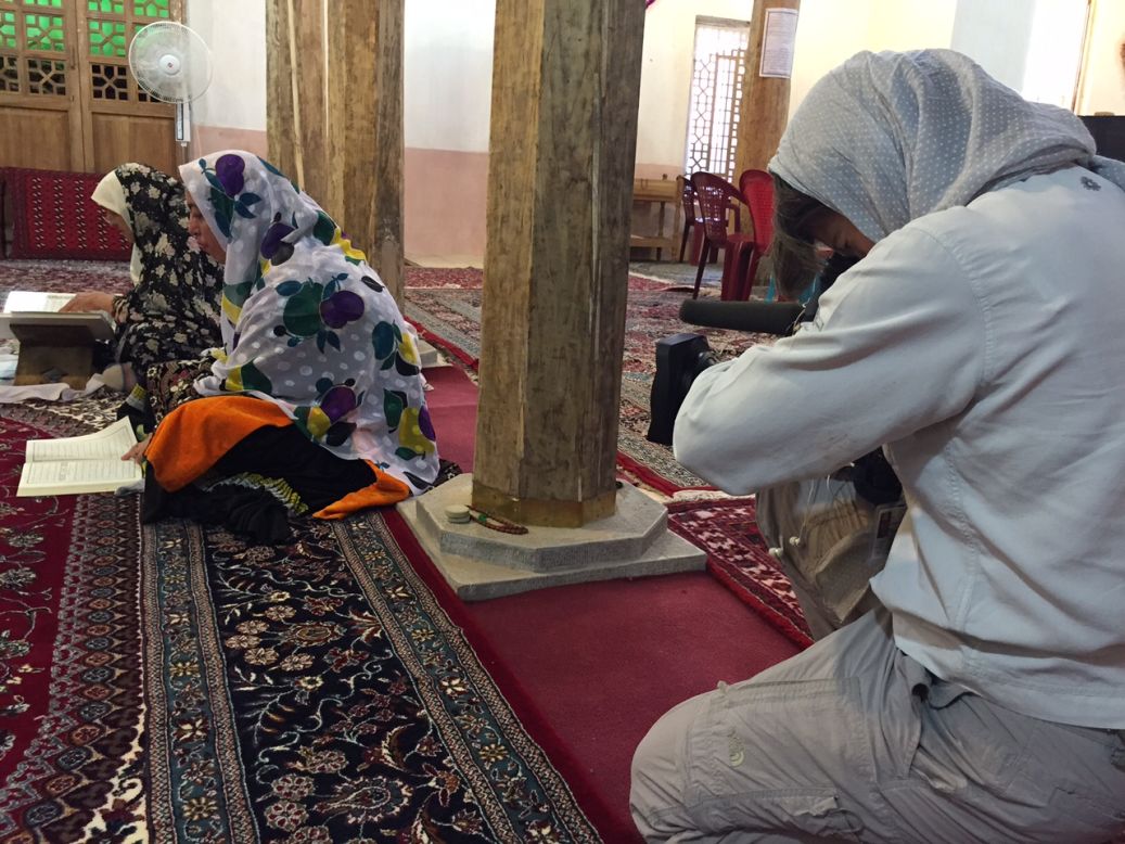 CNN camerawoman Claudia Otto films the women's Quran lesson. 