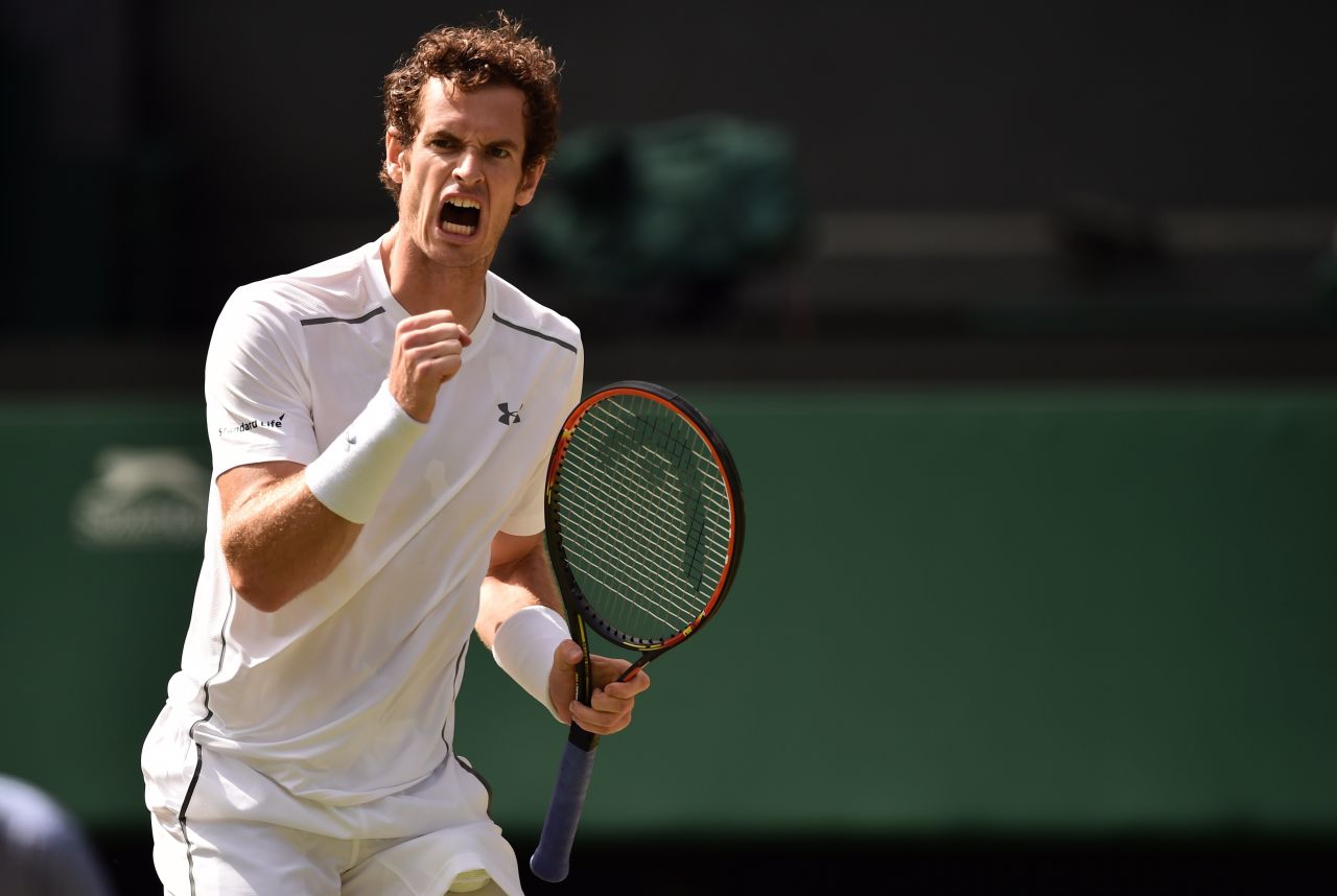 Andy Murray is pumping his fist and why not? He overcame the big serves of Ivo Karlovic in four sets and the 2013 champion next plays Canada's Vasek Pospisil. 