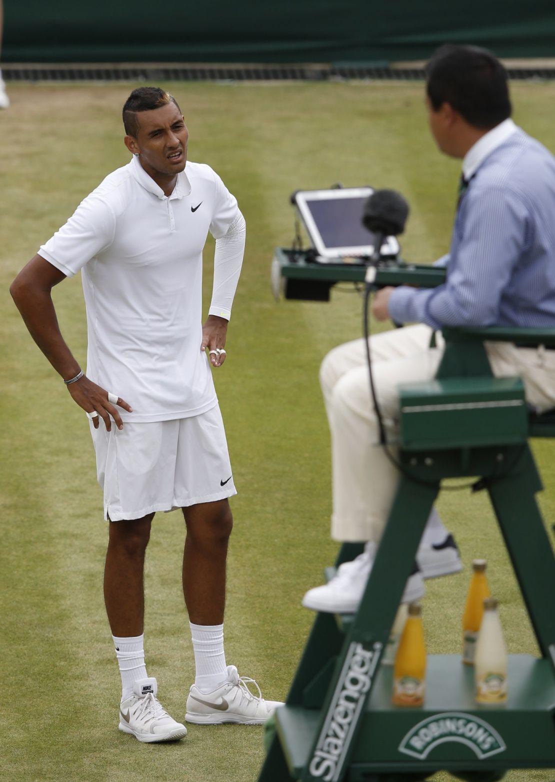 Australia's Nick Kyrgios argues a line call with the umpire during a Wimbledon match. 