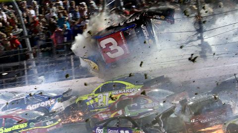 Austin Dillon's car crashes into a fence Sunday, July 5, during a last-lap crash at the NASCAR Sprint Cup race in Daytona Beach, Florida. Dillon walked away from the crash, but several fans were injured.