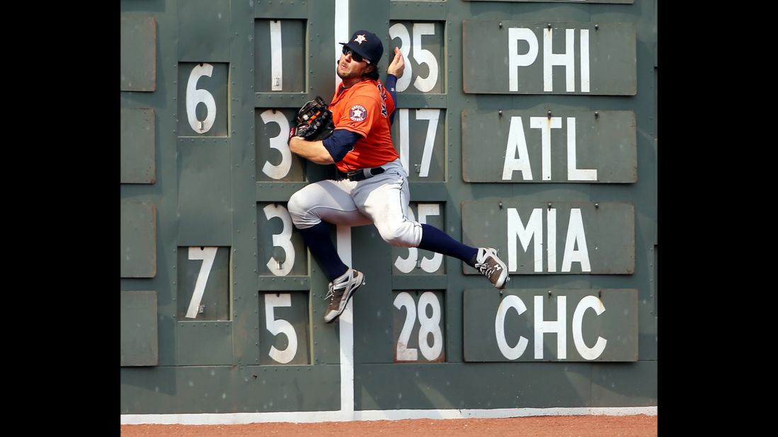Houston outfielder Jake Marisnick crashes into the wall while making a catch Sunday, July 5, in Boston.