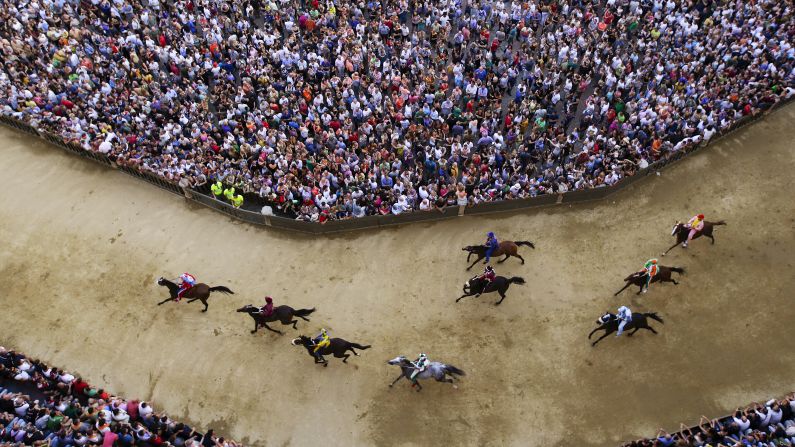 A practice session is held Wednesday, July 1, for the Palio di Siena, a bareback horse race held twice a year in Siena, Italy. <a href="index.php?page=&url=http%3A%2F%2Fwww.cnn.com%2F2013%2F08%2F26%2Fsport%2Fworlds-craziest-horse-festivals%2Findex.html" target="_blank">The historic race</a> dates to the 17th century. Ten riders represent their local neighborhood as they race around the iconic city square three times.