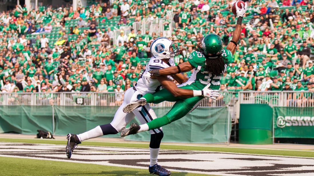Weldon Brown, a defensive back with the Saskatchewan Roughriders, breaks up a pass intended for Toronto's Tori Gurley, left, during a Canadian Football League game in Regina, Saskatchewan, on Sunday, July 5.