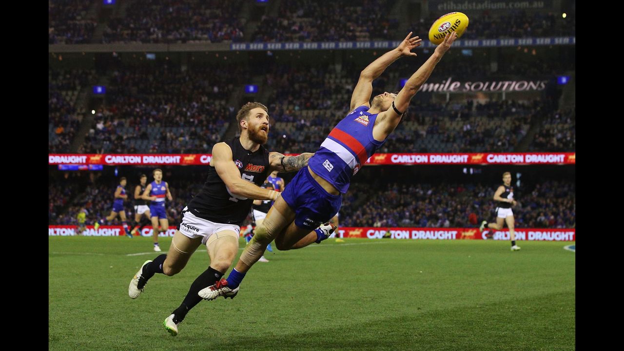 Luke Dahlhaus of the Western Bulldogs grabs the ball Saturday, July 4, during an Australian Football League match against the Carlton Blues in Melbourne.