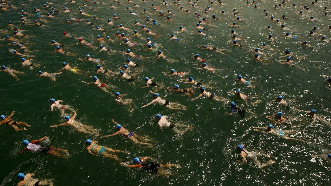 People swim across Lake Zurich during a public race held Wednesday, July 1, in Zurich, Switzerland. The race stretched over a distance of 1,500 meters (4,921 feet).