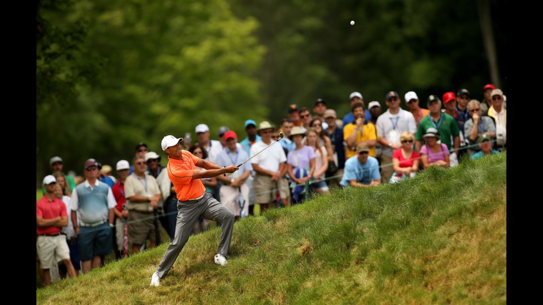 Tiger Woods hits a shot during the third round of the Greenbrier Classic on Saturday, July 4. Woods finished tied for 32nd in the event, which took place in White Sulphur Springs, West Virginia.