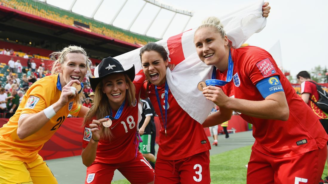 From left, England soccer players Carly Telford, Toni Duggan, Claire Rafferty and Steph Houghton show off their medals after defeating Germany 1-0 in the Women's World Cup third-place match on Saturday, July 4. 