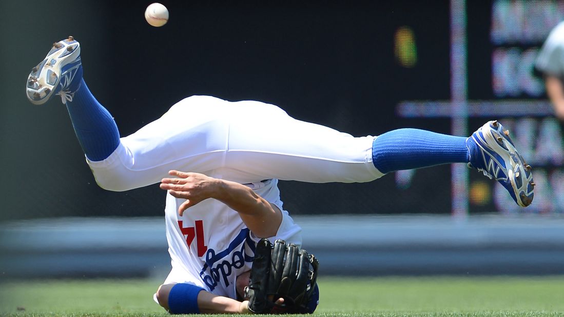 Los Angeles Dodgers shortstop Enrique Hernandez can't collect a ground ball during a home game against the New York Mets on Sunday, July 5.