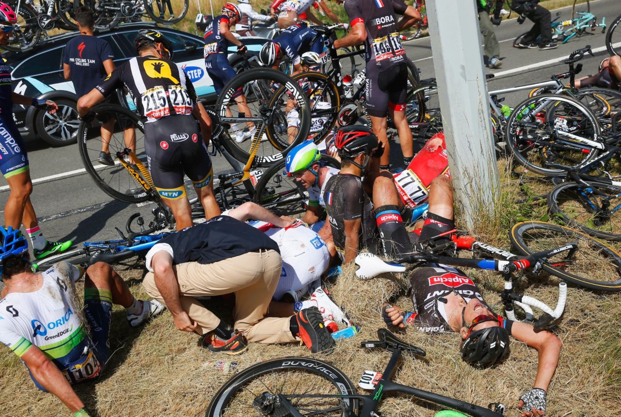 Riders and their bikes lay in crumpled heaps for several minutes as team and race officials rushed to their aid.