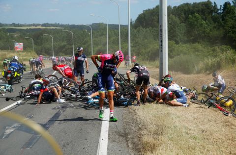 Filippo Pozzato of Italy and Lampre-Merida adjusts his clothing following a horrific high speed crash on the second stage.<br />