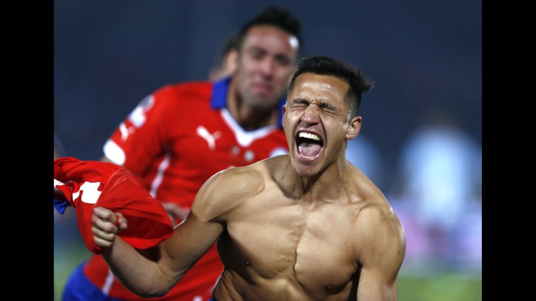 A shirtless Alexis Sanchez celebrates Saturday, July 4, after he scored the winning penalty kick for Chile in <a href="http://www.cnn.com/2015/07/04/football/football-copa-argentina-chile/" target="_blank">the final of the Copa America soccer tournament.</a> The match against Argentina went to a shootout after ending 0-0 in extra time. It is the first Copa America title for Chile, who hosted this year's tournament. 