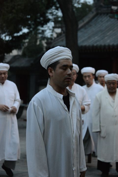 Shortly after the snacks, people return to the mosque's worship hall to perform the fourth prayer of the day.