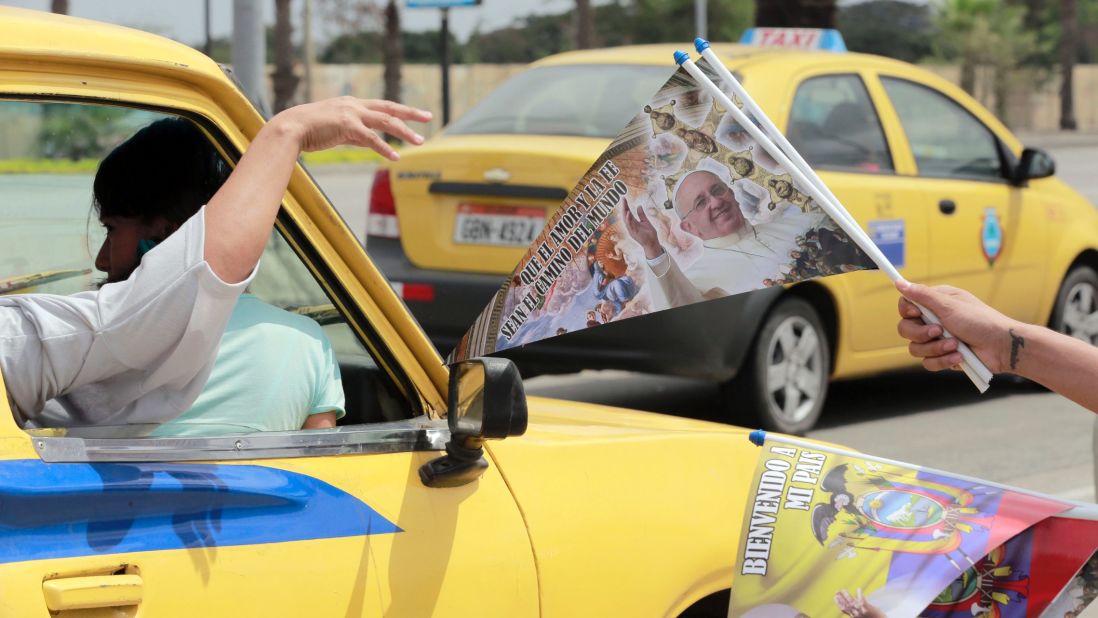 A street vendor sells commemorative flags at the entrance of Samanes Park in Guayaquil, Ecuador, on Sunday, July 5.