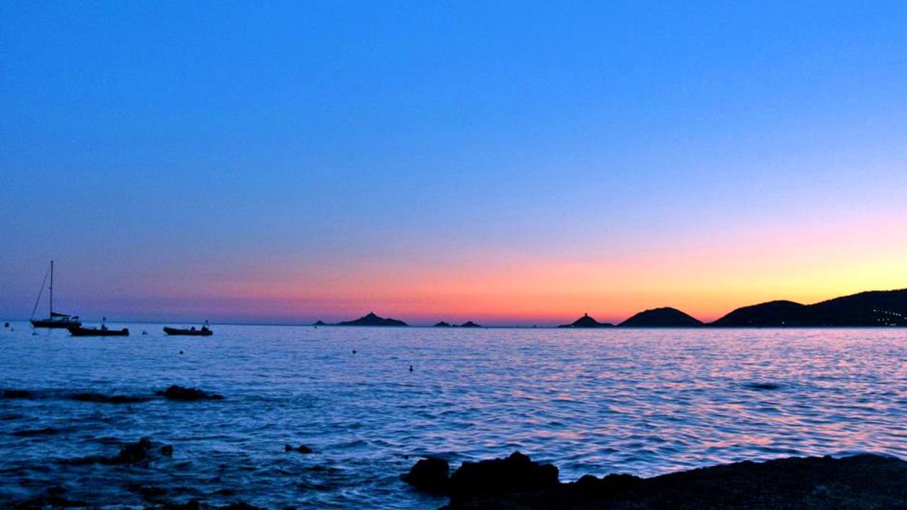 The sea and sky appear to bleed at sunset on Iles Sanguinaires, setting ablaze the reddish volcanic rocks and creating Corsica's best evening displays, according to locals.