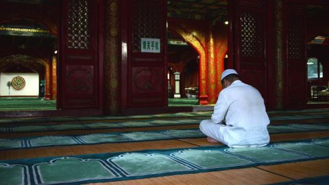 A man prays in Niujie Mosque, the oldest and largest mosque in Beijing, July 6. It was built in the year of 996.