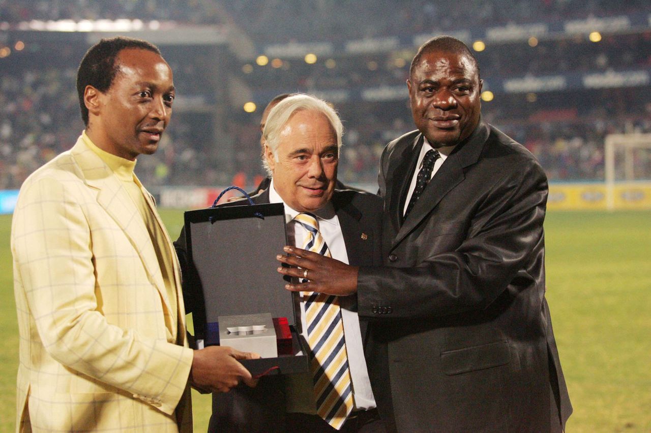 A soccer enthusiast, he is the owner of the Mamelodi Sundowns, a South African Premier League club based in Pretoria. He is pictured here before a friendly match against FC Barcelona, in 2007.