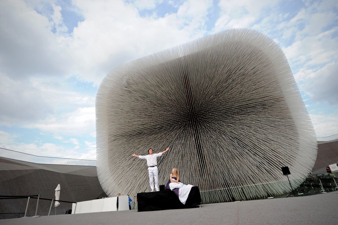 Actors perform in front of the UK Pavilion at the site of the 2010 World Expo  in Shanghai. 