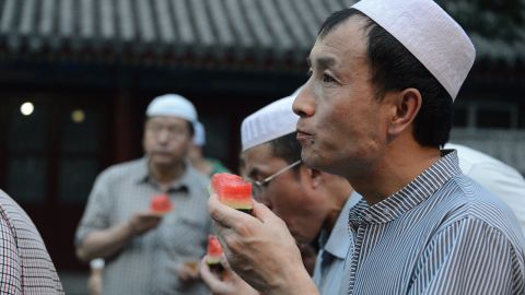 A man enjoys a piece of watermelon on July 6.