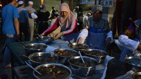 Women serve Iftar at the mosque, an evening meal Muslims eat together after ending their daily Ramadan fast.