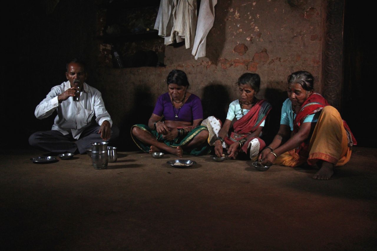 Sakharam Bhagat and his three wives, (from left) Tuki, Sakhri and Bhaagi, eat lunch at their house. Polygamy is illegal and a crime in India, but Bhagat says he had no other option but to marry two more times in order to have more helping hands to get water.