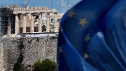 Caption:A European Union flag waves in front of the ancient temple of Parthenon atop the Acropolis hill in Athens on July 7, 2015. Eurozone leaders will hold an emergency summit in Brussels on July 7 to discuss the fallout from Greek voters' defiant 'No' to further austerity measures, with the country's Prime Minister Alexis Tsipras set to unveil new proposals for talks. AFP PHOTO /ARIS MESSINIS (Photo credit should read ARIS MESSINIS/AFP/Getty Images)